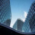 vertical shot modern office buildings with big reflective windows sunlight  x